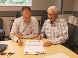 Jim in discussion with Barry Gullet, Director of Charlotte-Mecklenburg Utilities Department.